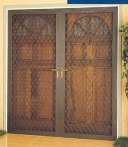 French double doors with a screen door in front