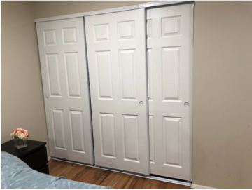 3 white sliding bedroom closet doors